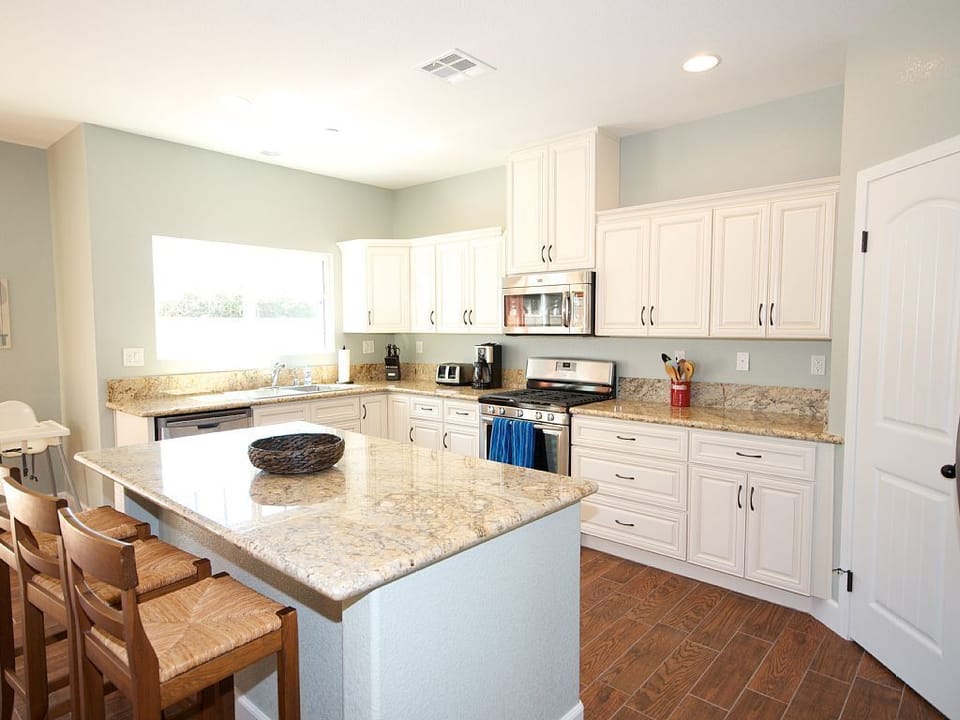 - Fully equipped kitchen with granite countertops and modern appliances   - Large island with seating perfect for cooking and entertaining guests   - Spacious kitchen design ideal for family meals and group dining events