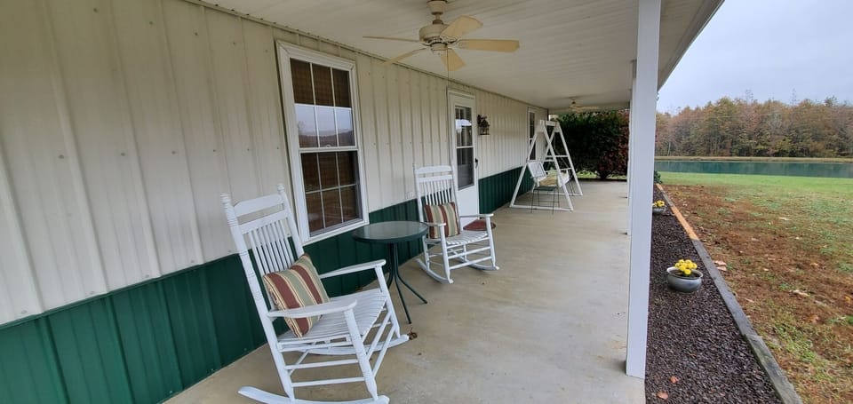 Front porch with swing and 2 rockers