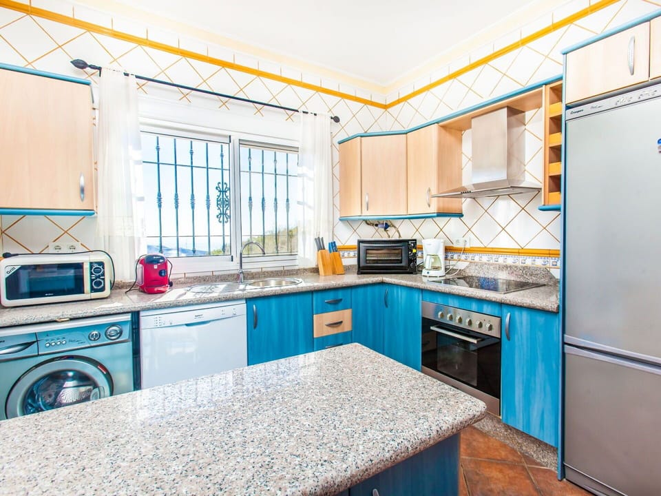 Room, Property, Cabinetry, Blue, Kitchen, Furniture, Yellow, Countertop, Real Estate, Turquoise