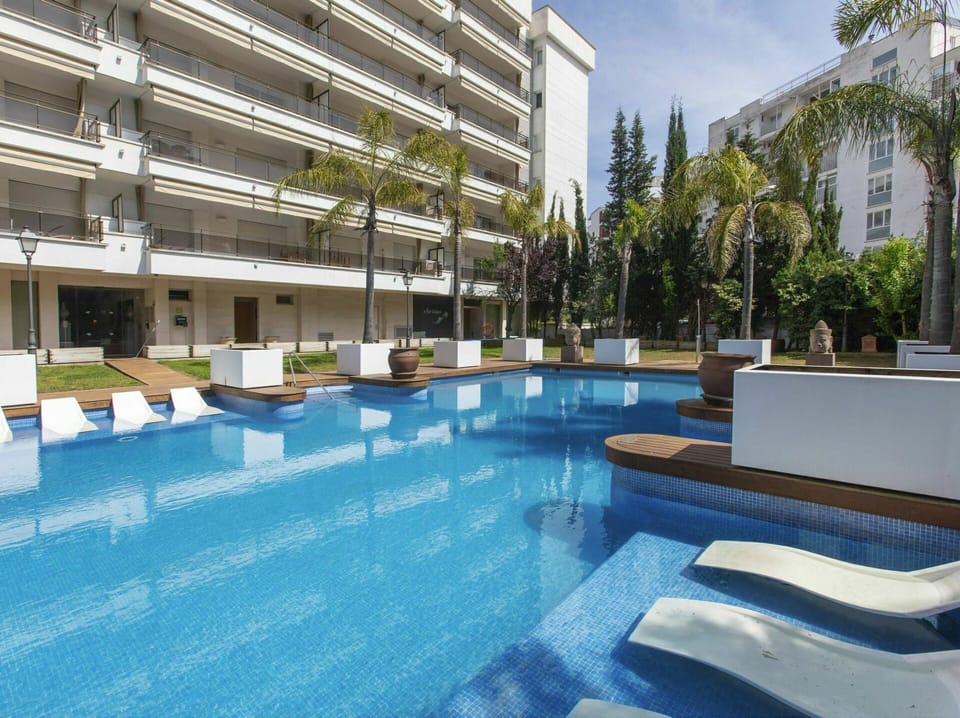 Building, Water, Plant, Swimming Pool, Sky, Azure, Shade, Interior Design, Outdoor Furniture, Tree