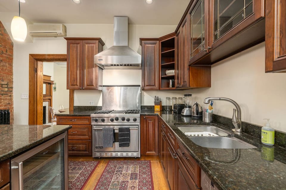 kitchen with oven, stove, and sink