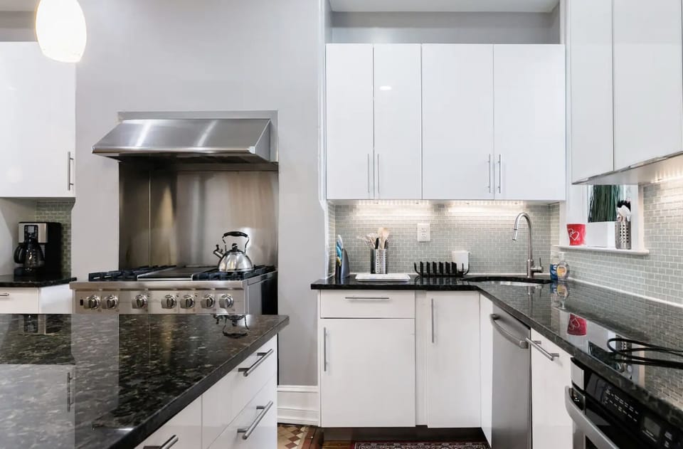 kitchen with oven/stove, counter space, sink, dishwasher, microwave