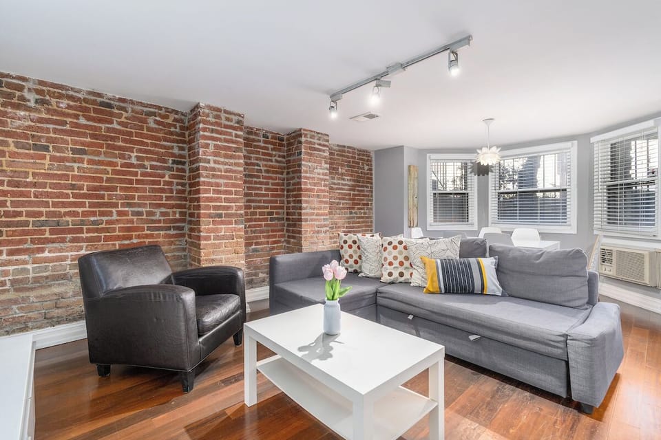 living room with sofa, arm chair, and coffee table