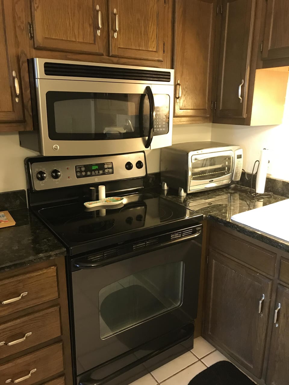 Matching range, microwave and dishwasher with granite countertops