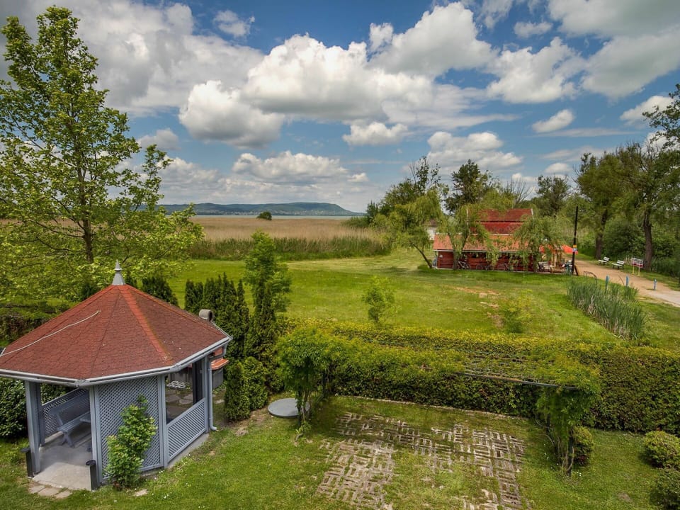 Cloud, Sky, Plant, Window, Building, Tree, Natural Landscape, Land Lot, House, Grass