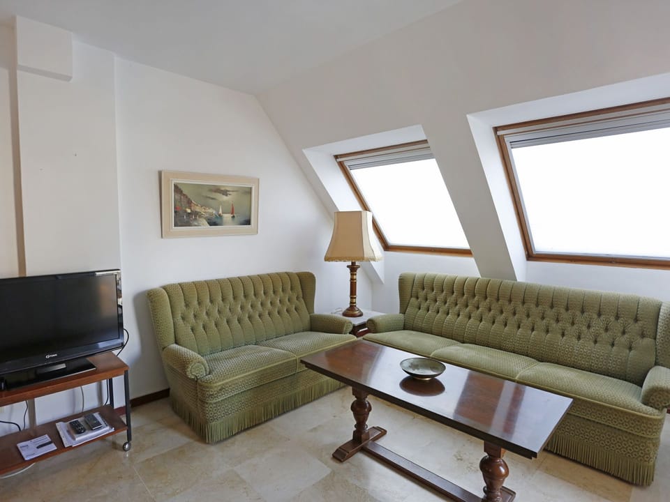 Furniture, Room, Property, Living Room, Interior Design, Couch, Floor, Table, Building, Wall