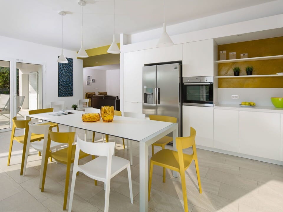 Room, Furniture, Property, Yellow, Interior Design, Kitchen, Dining Room, Countertop, Building, Cabinetry
