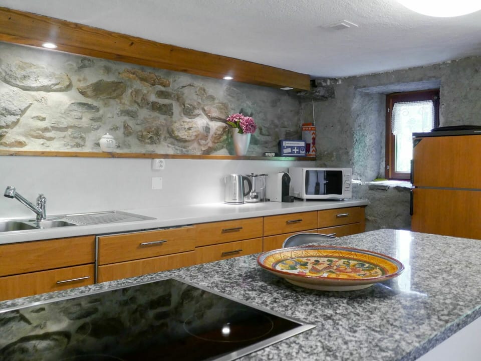 Countertop, Property, Room, Kitchen, Cabinetry, Interior Design, Furniture, Yellow, Tile, Sink