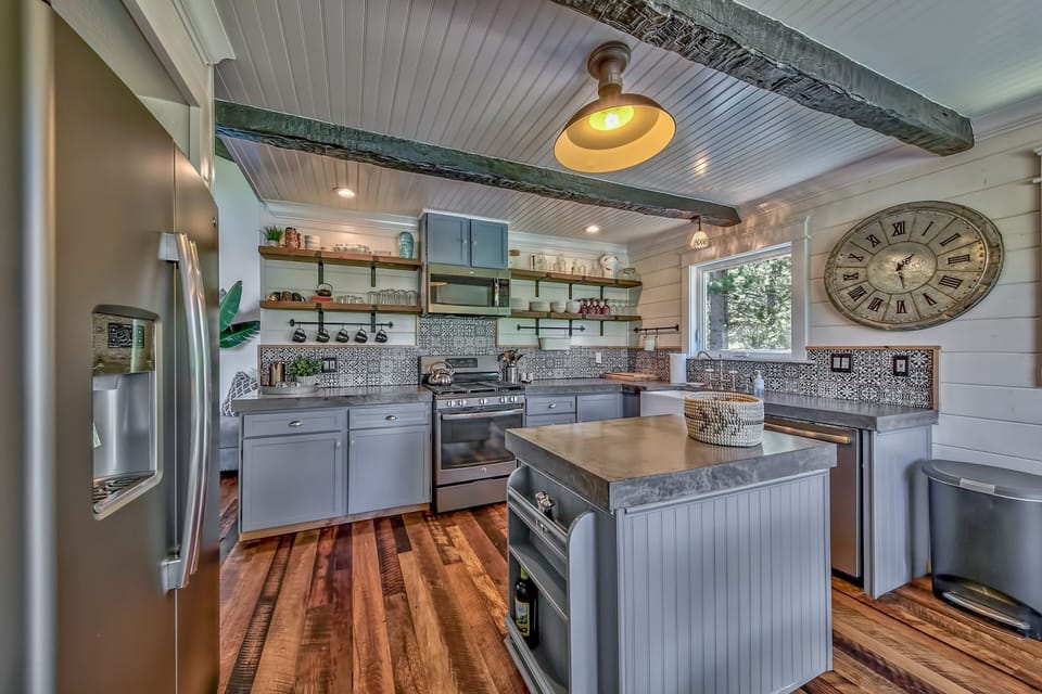 This cozy kitchen has all new appliances, gas cooktop, and natural stone counters