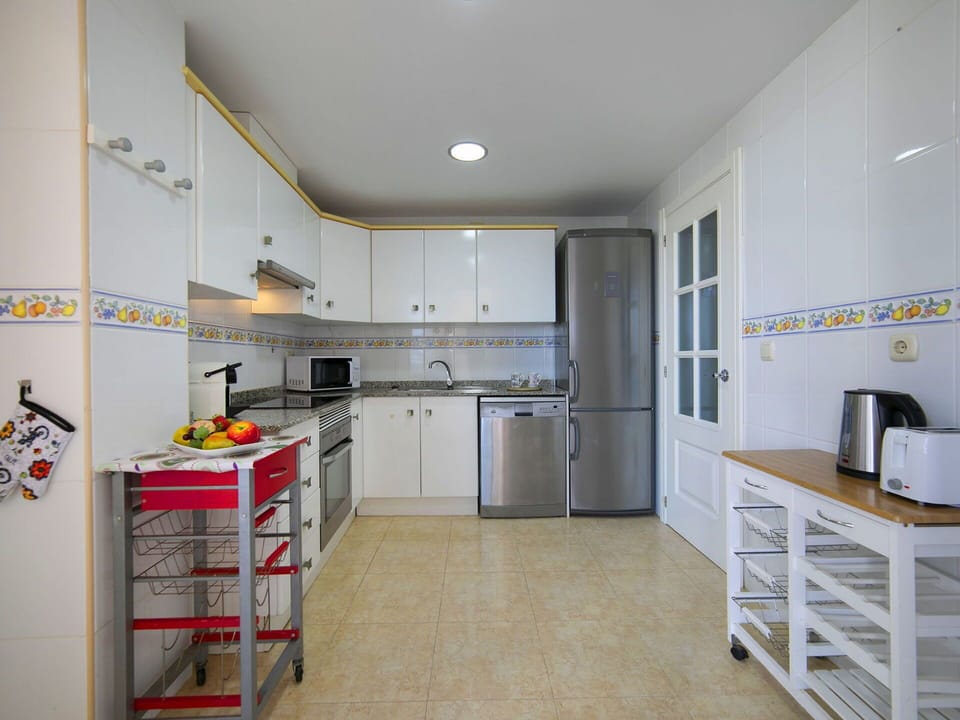 Kitchen, Countertop, Kitchen Appliance, Flooring, Cabinetry, Major Appliance, Floor, Wood, Furniture, Interior Design