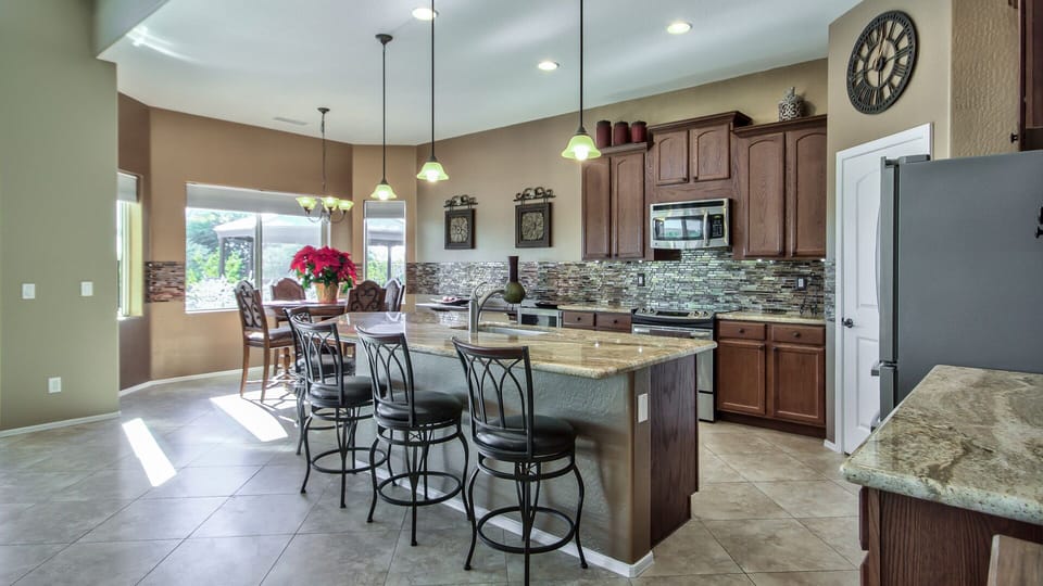 Spacious Kitchen with Granite Counters , Large Island & Stainless Appliances