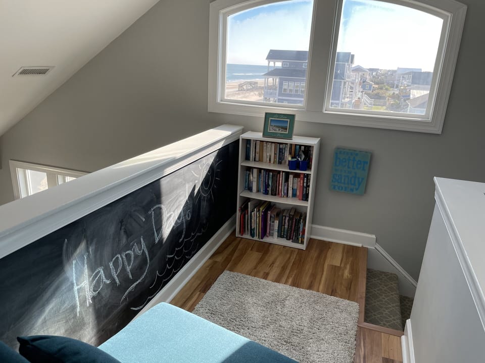 Sunny loft - Relax with a book in the chair bed (flips open) or enjoy the view.