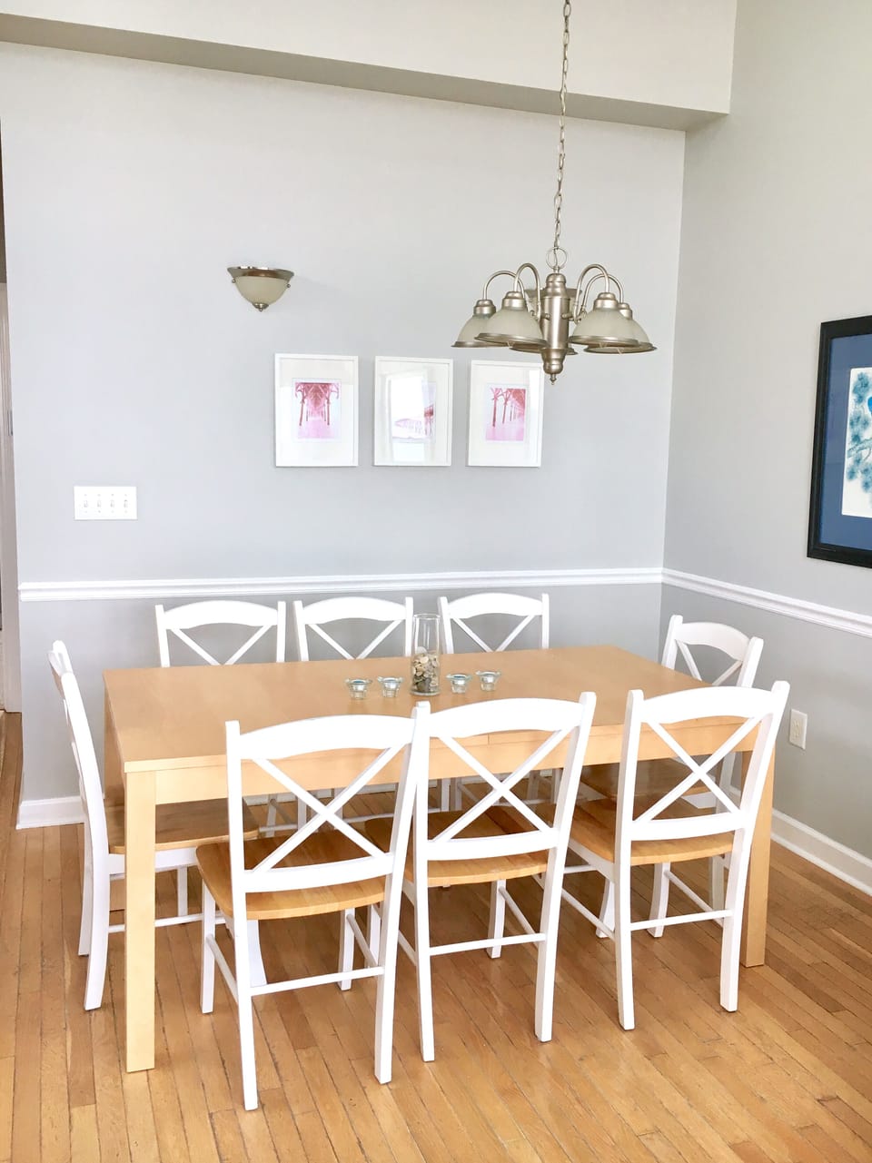 Freshly painted beach chic dining room expands to seat 12. 