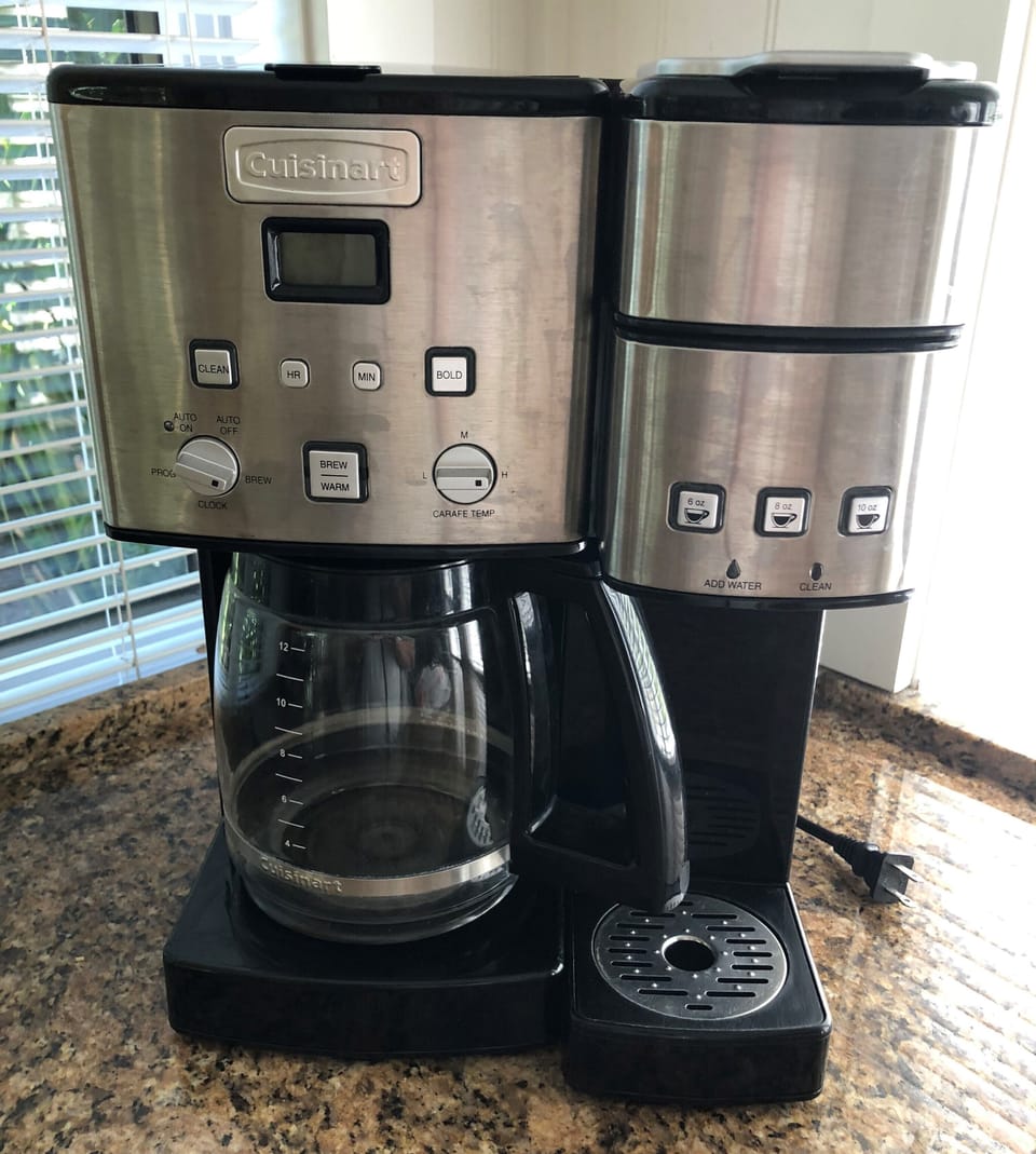 Coffee pot takes ground coffee. A reusable filter is included, however, paper filters can be used.