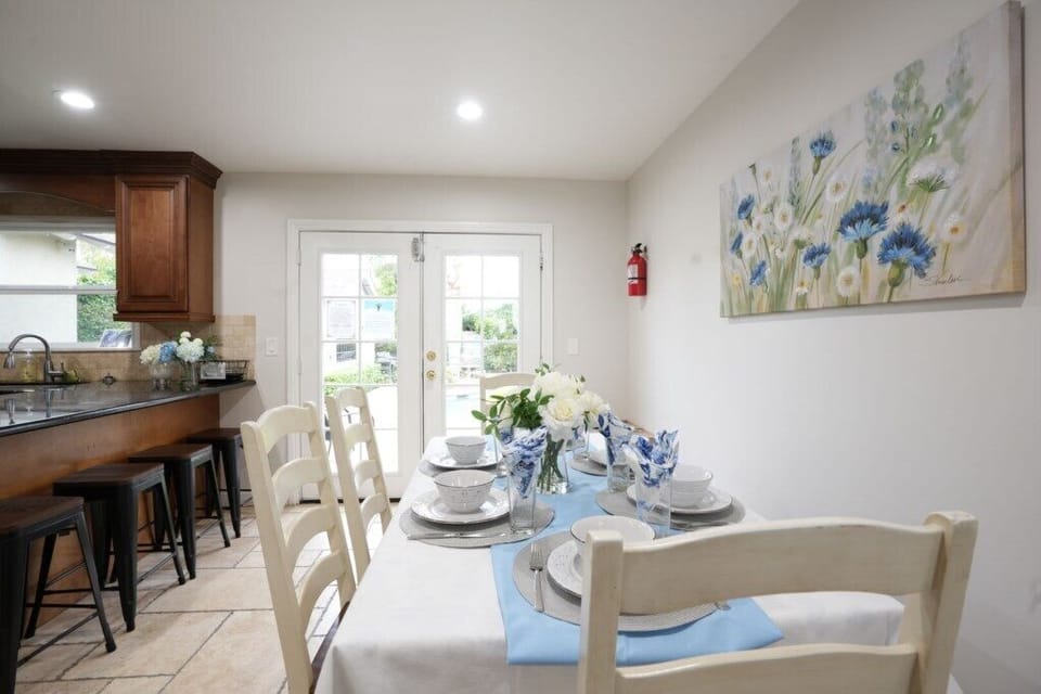 Dining Room with Pool view
Dining Room and Kitchen looking out to the pool