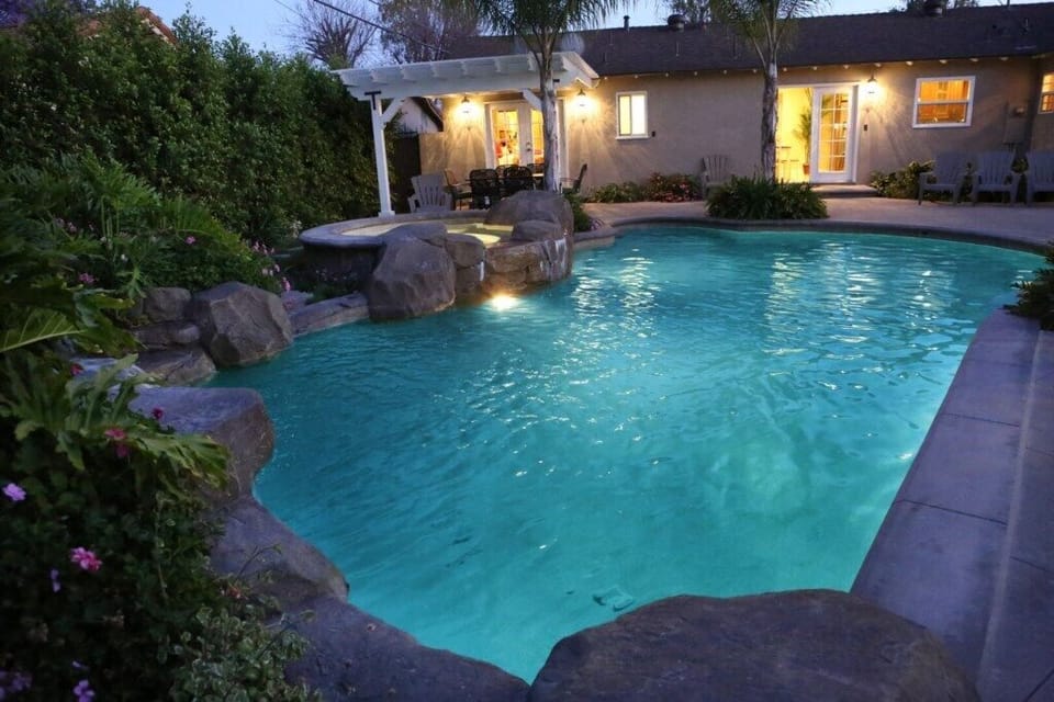 Spectacular Waterfall Rock Pool with In-ground Jacuzzi at Dusk