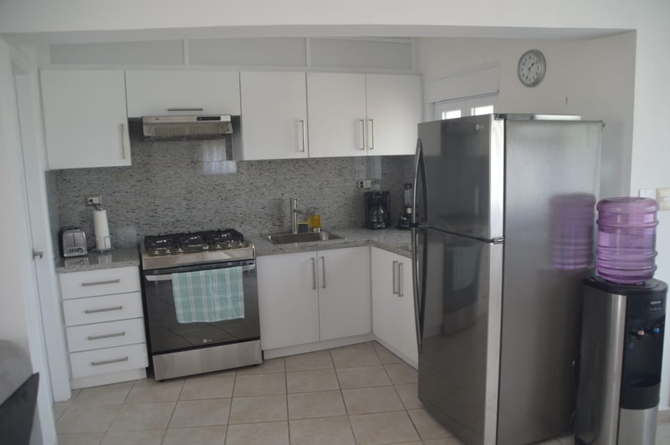 Kitchen close up view 30 gas stove\oven and large refrigerator 