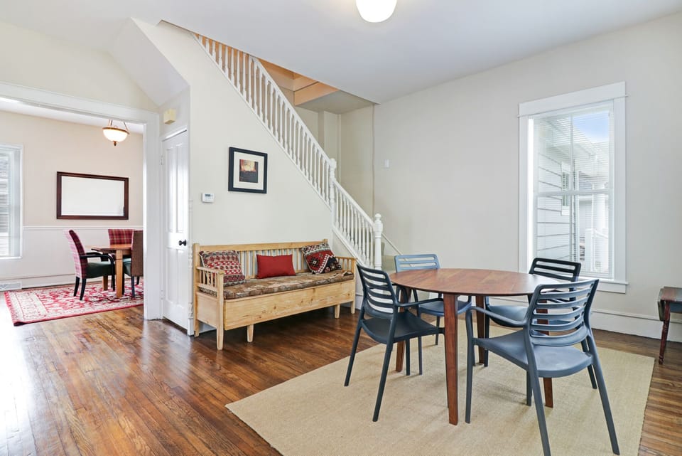 The stairs to the second floor are located in the front room.