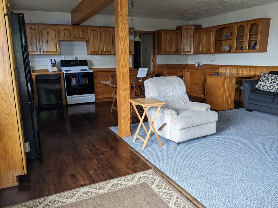 Entryway view of Living Space and Kitchen.