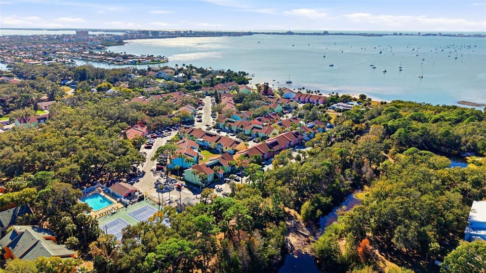 PRIVATE Beach Access | 2 Pools | vibrant waterfront resort community known for its colorful coastal architecture, private beach access, and resort style amenities. Located near the sand and surrounded by water views!