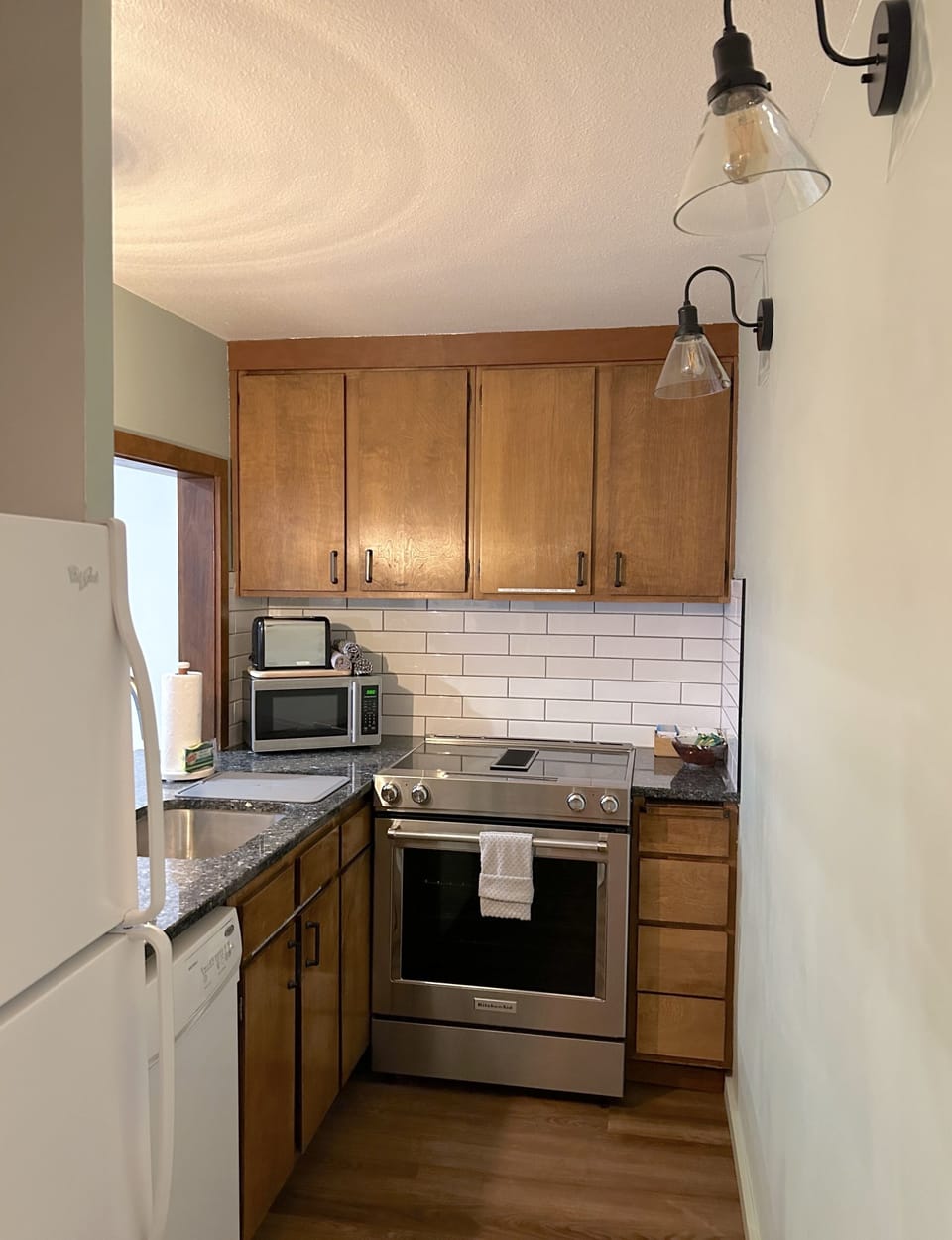 Kitchen is fully equipped with pots, pans and cooking utencils.