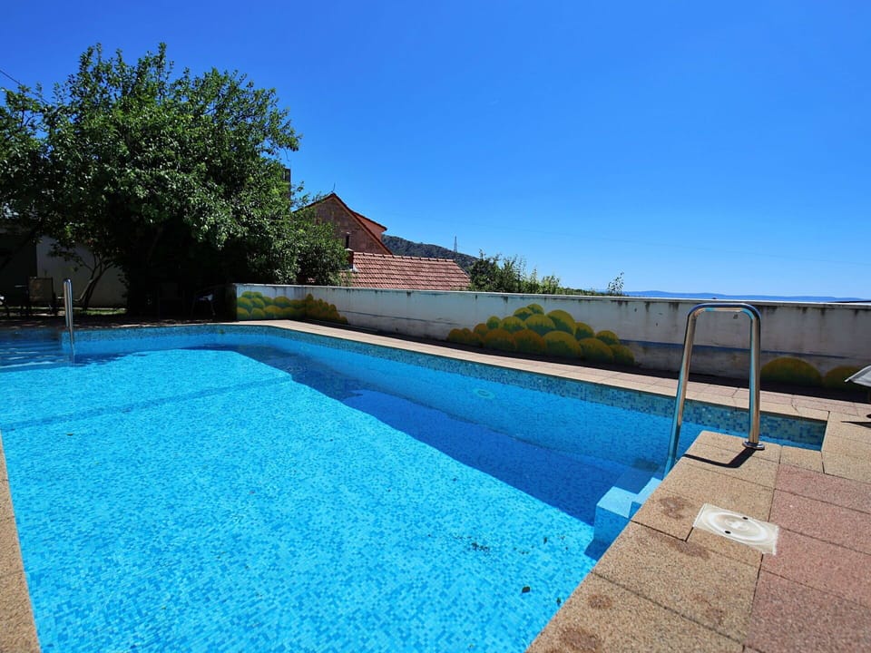 Sky, Water, Plant, Swimming Pool, Building, Azure, Shade, House, Rectangle, Composite Material