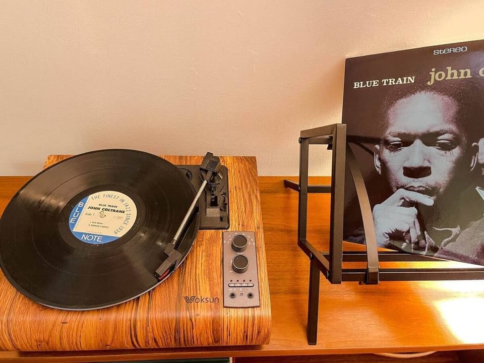 Primary Suite: Turntable with a collection of records.