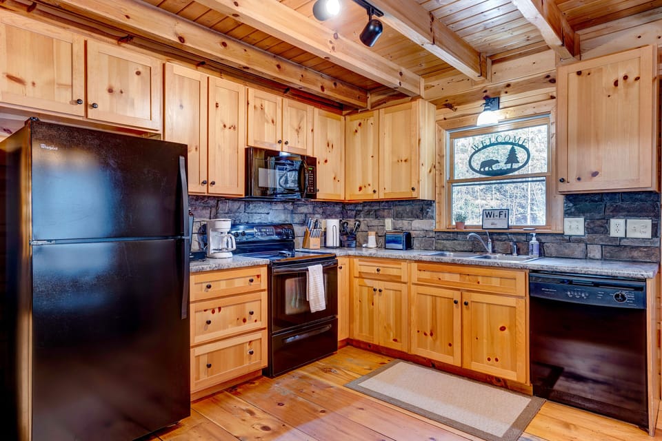 Full kitchen with plenty of cooking supplies 