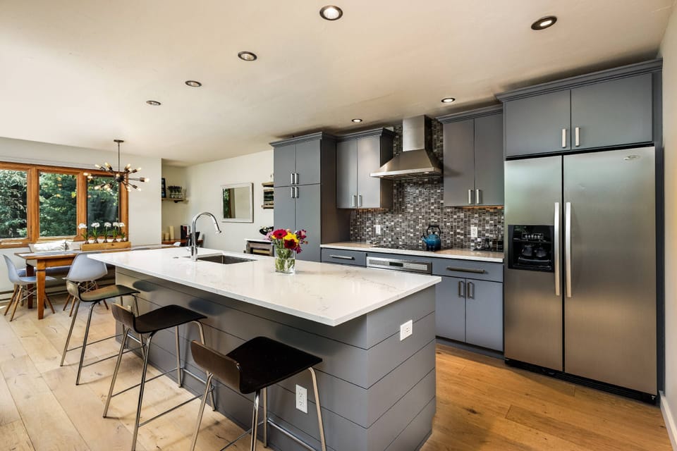 The kitchen offers high end appliances, a breakfast bar and is stocked with everything you need to prepare meals at home.