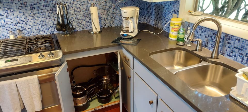 Stock kitchen. Pots , pans, dishwasher,  dual fuel stove , ice maker.