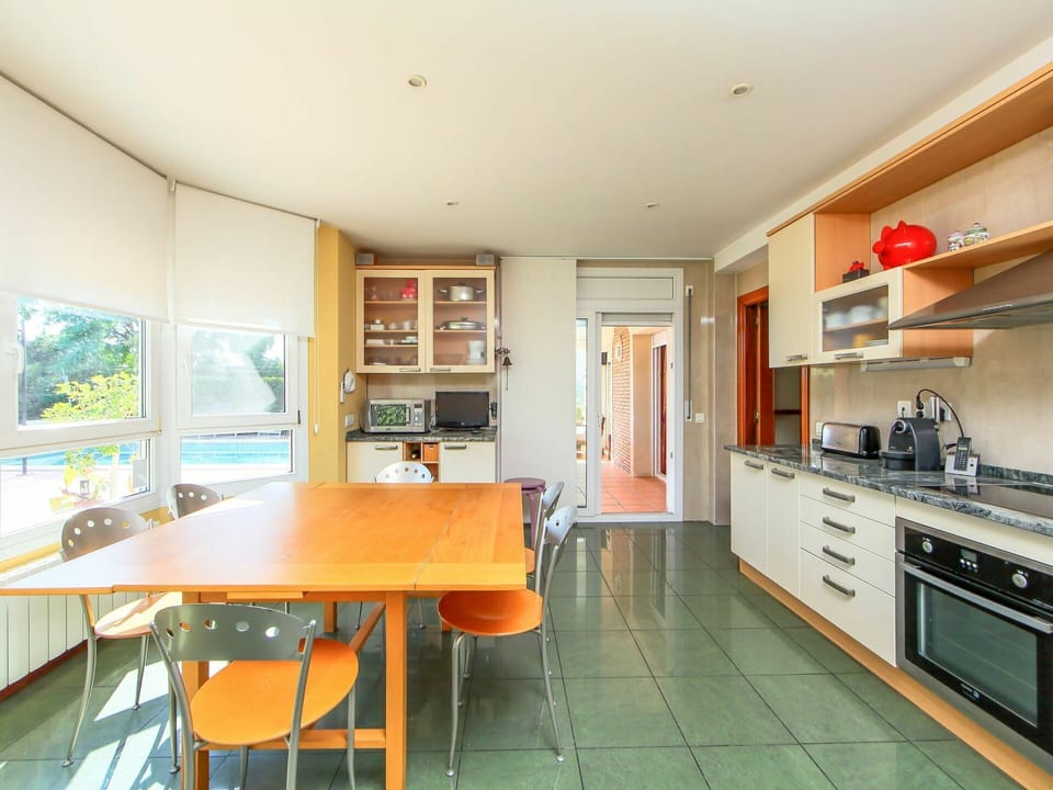 Furniture, Cabinetry, Property, Window, Countertop, Table, Kitchen, Shelf, Building, Gas Stove