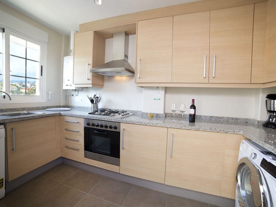 Countertop, Property, Cabinetry, Room, Kitchen, Furniture, Floor, Building, Interior Design, Major Appliance