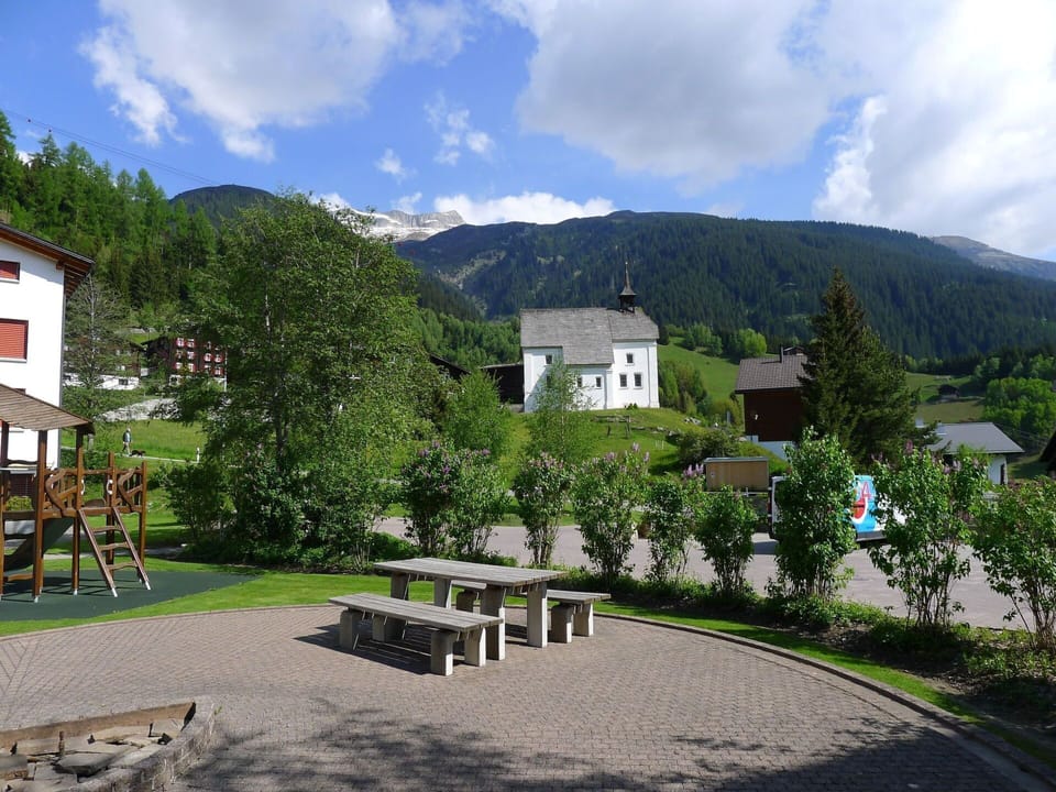 Cloud, Plant, Sky, Mountain, Building, Outdoor Bench, Tree, Natural Landscape, Window, Architecture