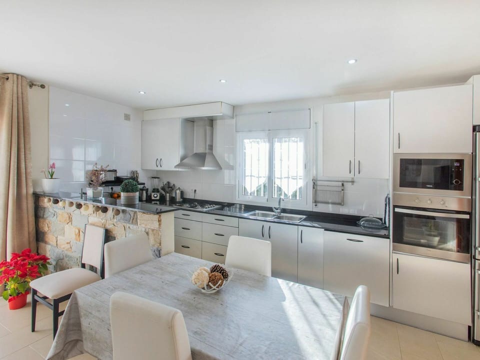 Furniture, Property, Countertop, Cabinetry, Kitchen Appliance, Interior Design, Kitchen, Flooring, Home Appliance
