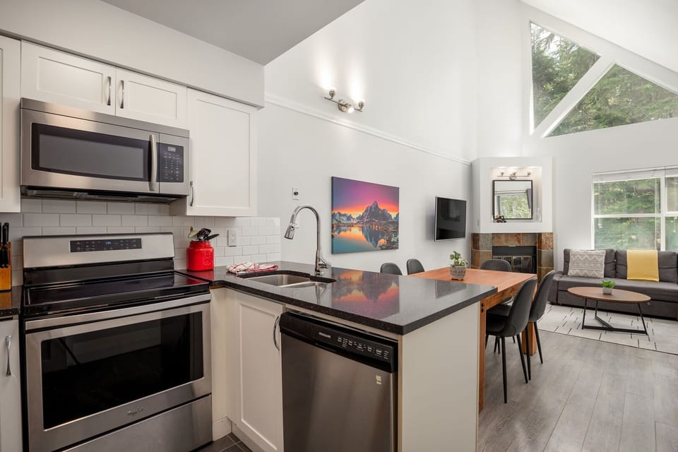 The fully equipped kitchen includes modern appliances and all your cooking essentials.