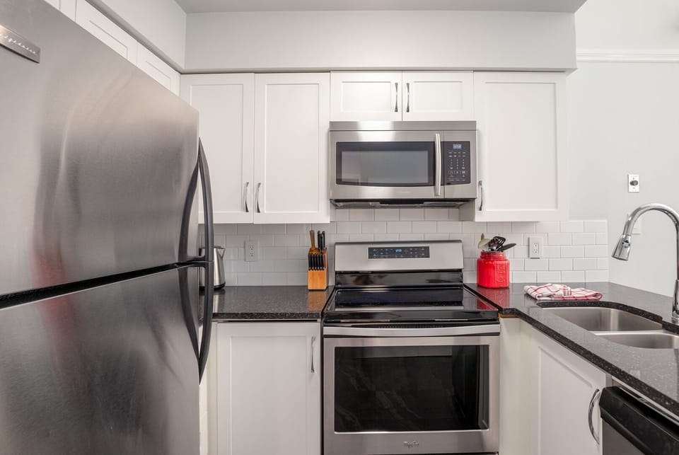 Fully equipped kitchen with granite counters & stainless steel appliances
