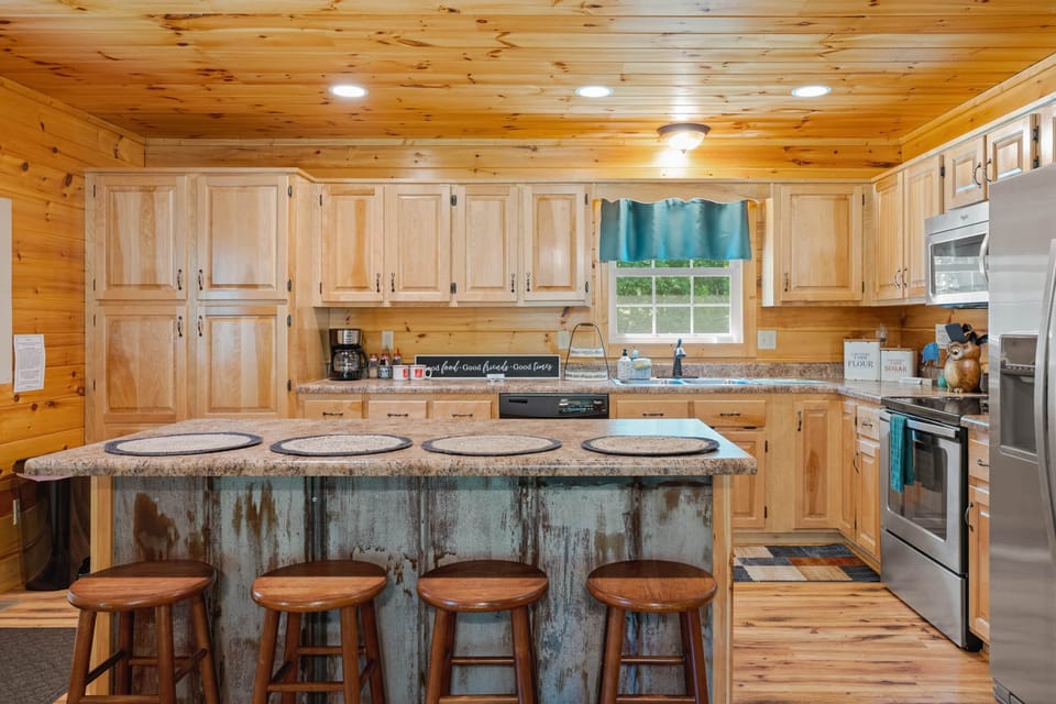 Spacious kitchen w/hand-crafted birch cabinetry & stainless appliances. (2)