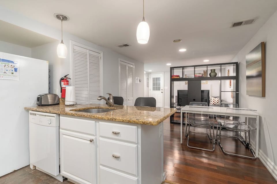 kitchen island with view of dining and tv area