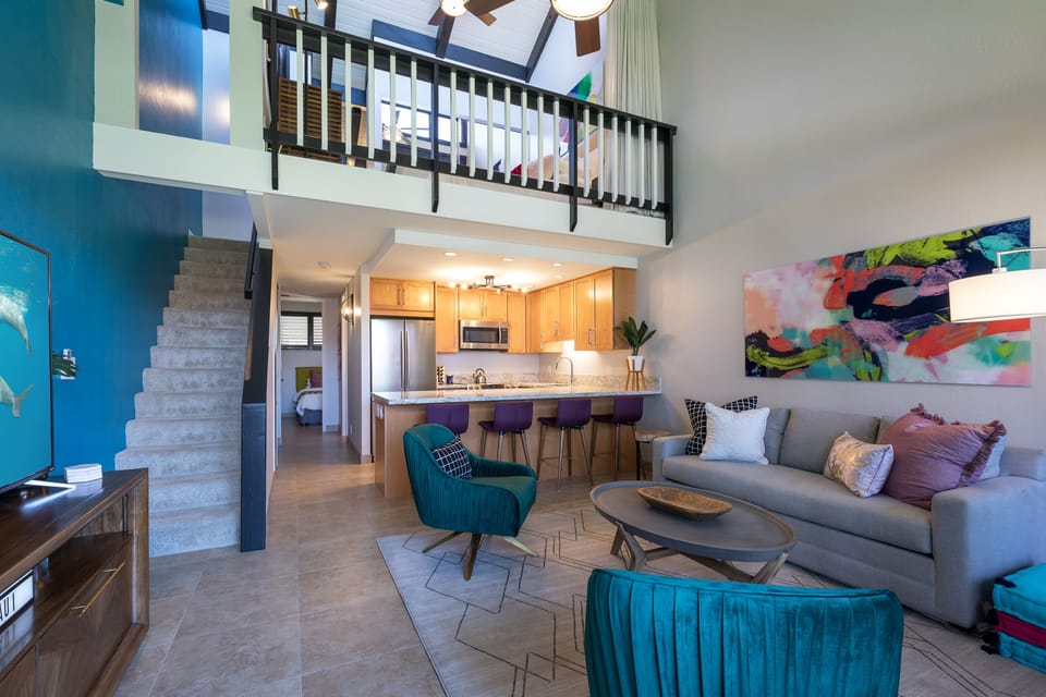 Large open floor plan with tall vaulted ceilings.