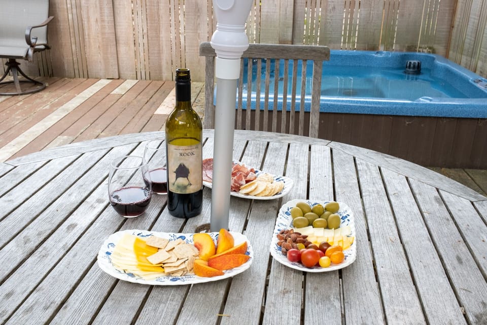 Relax in the hot tub and enjoy a snack on the patio