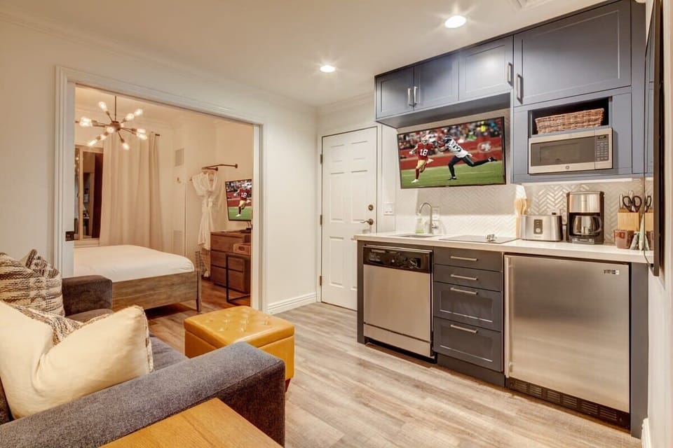 Small living area and kitchen on second side, and second bedroom.