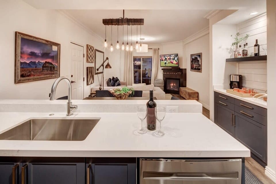 Kitchen looking to dining area and living room