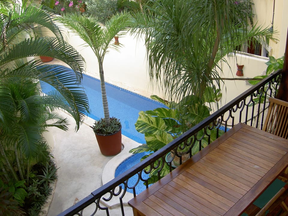 Lush Gardens and Tiled Pool.
