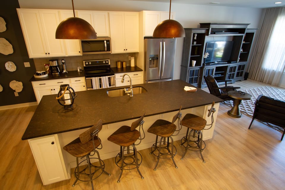 Grand island Centered on the main floor.  Lots of space to display family meals.
