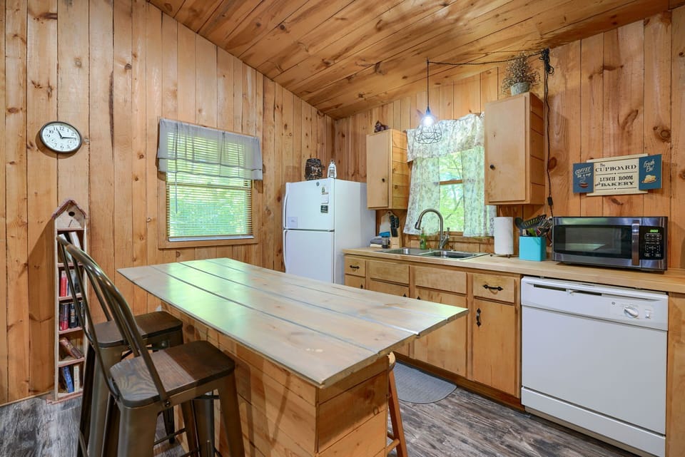 Kitchen with dining island, dishwasher in view