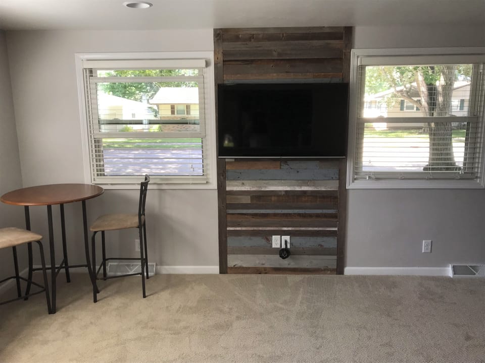 View of TV from kitchen through pass through. Blu-ray/DVD player included.