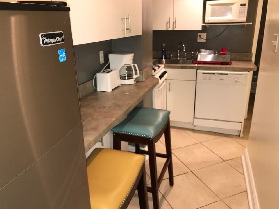 Kitchen with deep sink, dishwasher, refrigerator, hot plate, coffee maker, etc

