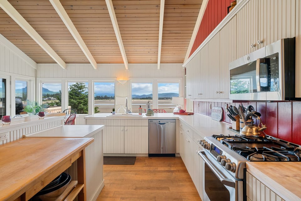Kitchen looks out toward the water 