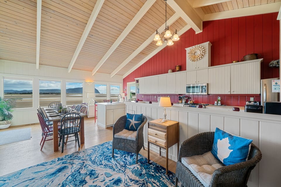 Seating area in front of the fireplace is adjacent to the kitchen & dining area