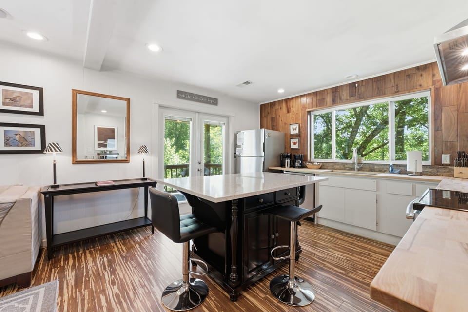 Kitchen. French doors lead to covered side porch. 